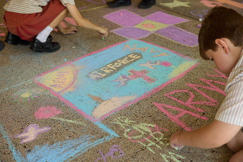 A student working on their creation for Draw to Remember